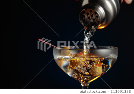 Martini with green olives. 113991358