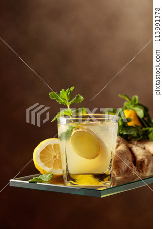 Refreshing summer cocktail with natural ice, ginger, lemon, and mint. Refreshing summer cocktail with natural ice, ginger, lemon, and mint. 113991378