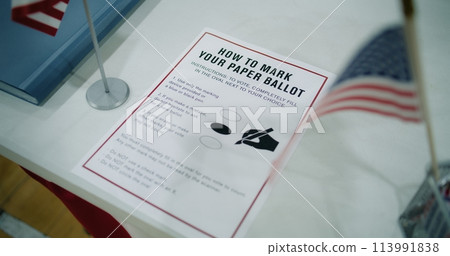 Close up of instruction on how to vote on the paper ballot lying on table Close up of instruction on how to vote on the paper ballot lying on table 113991838
