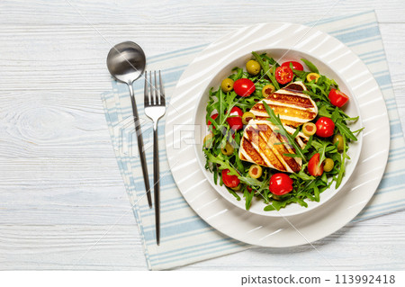 salad with grilled halloumi greek cheese in bowl salad with grilled halloumi greek cheese in bowl 113992418