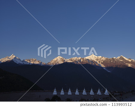 meili snow mountain at sunrise with with white pagodas, yunnan, china meili snow mountain at sunrise with with white pagodas, yunnan, china 113993512