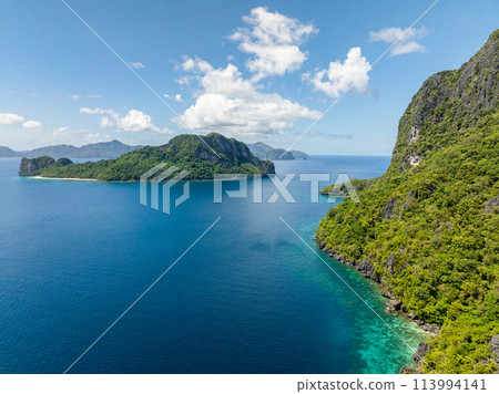 Blue sea in Cadlao and Helicopter Island. Blue sky and clouds. El Nido, Palawan. Philippines. 113994141