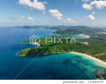Tropical Sandy Beaches on coastline in El Nido. Nacpan Beach. Palawan, Philippines. Tropical Sandy Beaches on coastline in El Nido. Nacpan Beach. Palawan, Philippines. 113994145