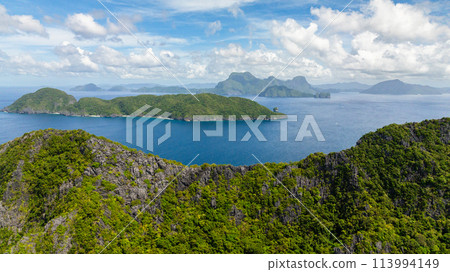 Tropical landscape of Islands and blue sea. Blue sky and clouds. El Nido, Philippines. 113994149