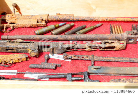 Rusty remains of weapons and ammunition from the Second World War 113994660