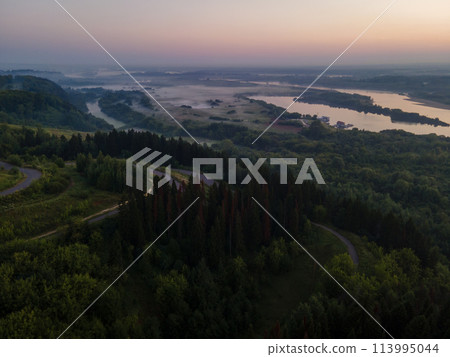 Landscape with thick forest and fog and long rivers at the sunset 113995044