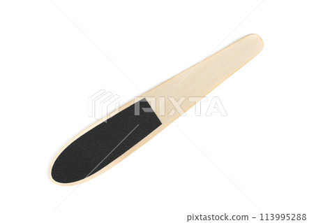 Top view of elegant wooden pedicure foot grater with handle on white background. 113995288
