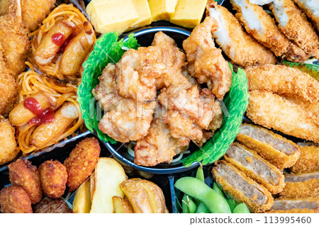 A photo of hors d'oeuvres with various dishes. An image of a party. A photo of hors d'oeuvres with various dishes. An image of a party. 113995460