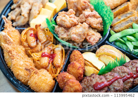 A photo of hors d'oeuvres with various dishes. An image of a party. 113995462