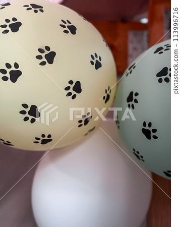 Balloons with black paw prints of cats. 113996716