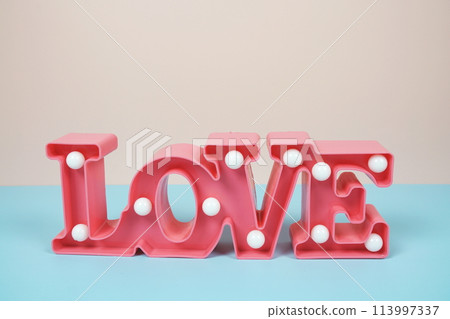 Valentine's Day Background with Love alphabet letter on pink and blue background 113997337