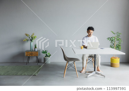 Man using a computer 113997391