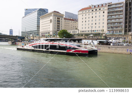 Pleasure boat on the Donaukanal canal in Vienna Pleasure boat on the Donaukanal canal in Vienna 113998633