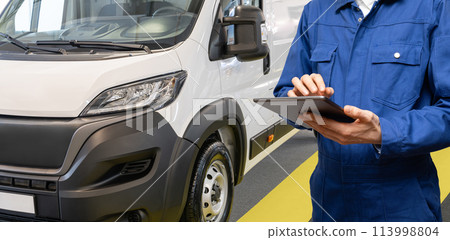 Manager with a digital tablet on the background of delivery van. Fleet management Manager with a digital tablet on the background of delivery van. Fleet management 113998804