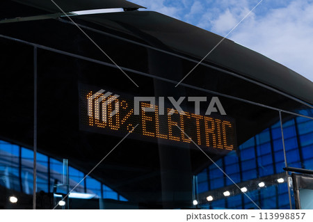 Electric bus sighboard close up. Inscription 100 percent electric. Electric bus sighboard close up. Inscription 100 percent electric. 113998857
