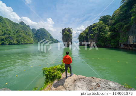 A tourist travel at Khao Phing Kan, Ko Ta Pu, Phang Nga, lush green trees from above in tropical forest in national park in summer season. Natural landscape background. 114001873