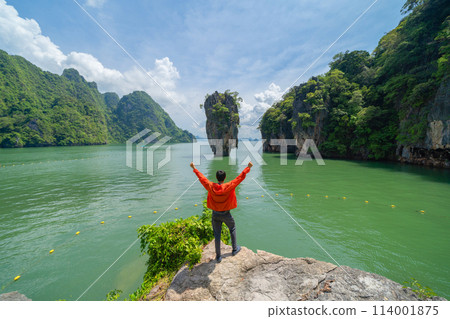 A tourist travel at Khao Phing Kan, Ko Ta Pu, Phang Nga, lush green trees from above in tropical forest in national park in summer season. Natural landscape background. 114001875