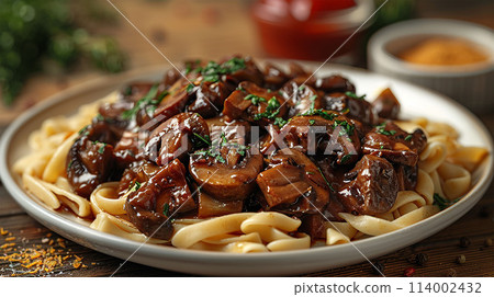 Delicious beef stroganoff with mushrooms on plate 114002432