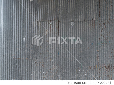 Metal steel strips. Rusty corrugated iron metal, Zinc steel wall, pattern texture background. Close-up of exterior architecture material for design decoration background. Metal steel strips. Rusty corrugated iron metal, Zinc steel wall, pattern texture background. Close-up of exterior architecture material for design decoration background. 114002781