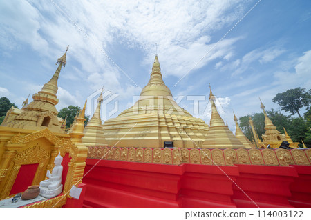 The Isan pagoda is a buddhist temple near Bangkok, an urban city town, Thailand. Thai architecture landscape background. Tourist attraction landmark. 114003122