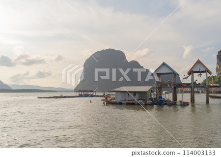 Koh Panyee, The Floating village urban city town houses, lake sea or river. Nature landscape fisheries and fishing tools at Pak Pha, Phang Nga, Thailand. Aquaculture farming 114003133