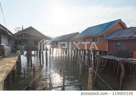 Koh Panyee, The Floating village urban city town houses, lake sea or river. Nature landscape fisheries and fishing tools at Pak Pha, Phang Nga, Thailand. Aquaculture farming 114003139
