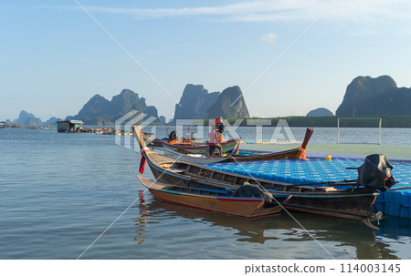 Koh Panyee, The Floating village urban city town houses, lake sea or river. Nature landscape fisheries and fishing tools at Pak Pha, Phang Nga, Thailand. Aquaculture farming 114003145