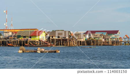Koh Panyee, The Floating village urban city town houses, lake sea or river. Nature landscape fisheries and fishing tools at Pak Pha, Phang Nga, Thailand. Aquaculture farming 114003150