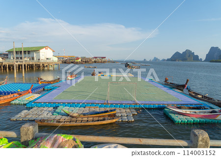 Koh Panyee, The Floating village urban city town houses, lake sea or river. Nature landscape fisheries and fishing tools at Pak Pha, Phang Nga, Thailand. Aquaculture farming 114003152