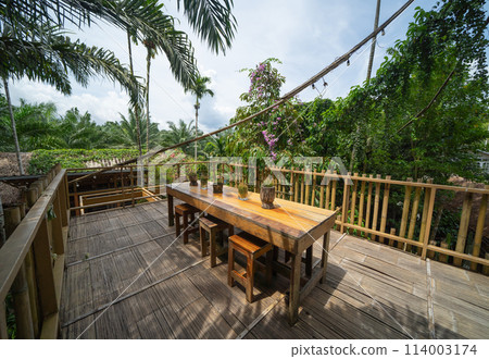 Thai restaurant with nature forest trees. Interior design. Thai restaurant with nature forest trees. Interior design. 114003174