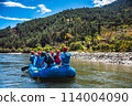 Punakha, Bhutan - Tourists ride on the rafting facility, providing an interesting experience for travel enthusiasts 114004090