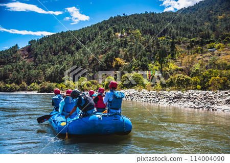 Punakha, Bhutan - Tourists ride on the rafting facility, providing an interesting experience for travel enthusiasts 114004090