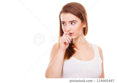 Teenage woman looking worried, thinking about something 114005487