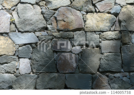 Stone wall texture background - grey stone with different sized stones Stone wall texture background - grey stone with different sized stones 114005738