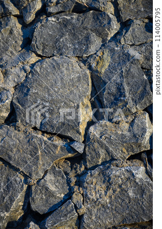 Old weathered stone wall of medieval fortress brick horizontal grunge background 2 Old weathered stone wall of medieval fortress brick horizontal grunge background 2 114005795