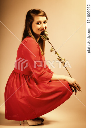 Fashion woman teen girl in red gown with dry rose. Fashion woman teen girl in red gown with dry rose. 114006032