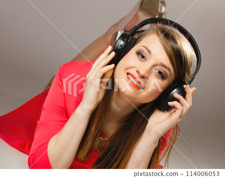 Technology, music - smiling teen girl in headphones 114006053