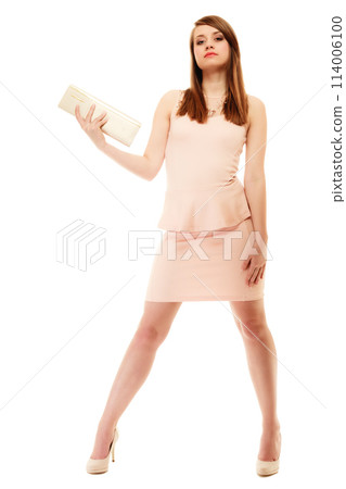 Elegance. Full length of girl in pink dress and with handbag Elegance. Full length of girl in pink dress and with handbag 114006100
