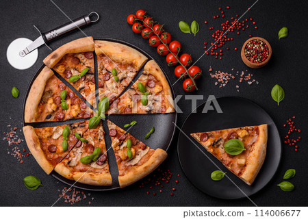 Delicious pizza with sausage, cheese, tomatoes, salt, spices and herbs Delicious pizza with sausage, cheese, tomatoes, salt, spices and herbs 114006677