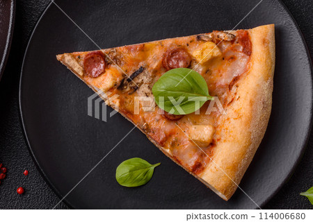 Delicious pizza with sausage, cheese, tomatoes, salt, spices and herbs Delicious pizza with sausage, cheese, tomatoes, salt, spices and herbs 114006680