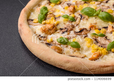 Delicious pizza with corn, cheese, tomatoes and mushrooms, salt, spices and herbs 114006699