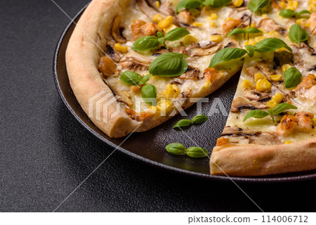 Delicious pizza with corn, cheese, tomatoes and mushrooms, salt, spices and herbs Delicious pizza with corn, cheese, tomatoes and mushrooms, salt, spices and herbs 114006712