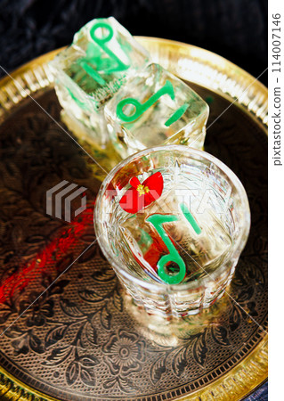 Alcoholic drink. A cocktail with elite alcohol on dark black background 114007146