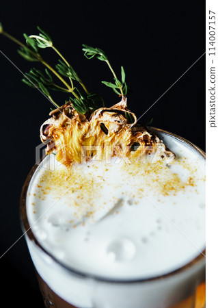 Alcoholic drink. A cocktail with elite alcohol on dark black background Alcoholic drink. A cocktail with elite alcohol on dark black background 114007157