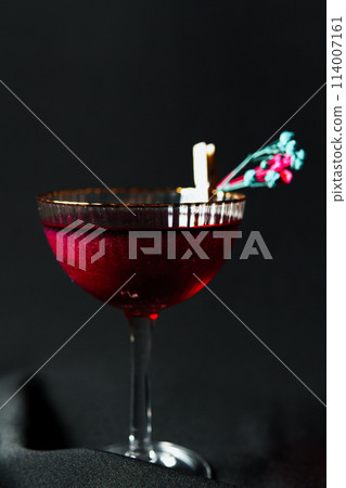 Alcoholic drink. A cocktail with elite alcohol on dark black background 114007161