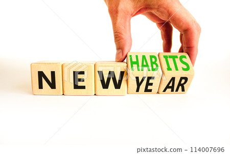 New year and habits symbol. Concept word New year New habits on wooden cubes. Beautiful white table white background. Psychologist hand. Psychological new year and habits concept. Copy space. 114007696