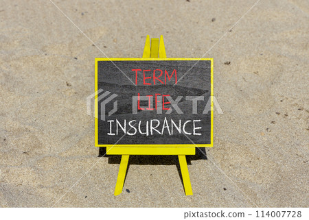 Term life insurance symbol. Concept words Term life insurance on beautiful black chalk blackboard. Beautiful sand beach background. Medical term life insurance concept. Copy space. 114007728