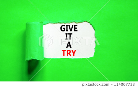 Give it a try symbol. Concept word Give it a try on beautiful white paper. Beautiful green paper background. Business give it a try concept. Copy space. Give it a try symbol. Concept word Give it a try on beautiful white paper. Beautiful green paper background. Business give it a try concept. Copy space. 114007738