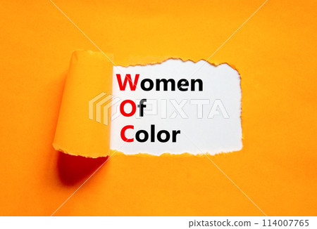 WOC women of color symbol. Concept words WOC women of color on beautiful white paper. Beautiful orange paper background. Business WOC women of color social issues concept. Copy space. 114007765