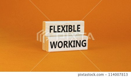 Flexible working symbol. Concept words Flexible working on beautiful wooden blocks. Beautiful orange table orange background. Business flexible working concept. Copy space. 114007813